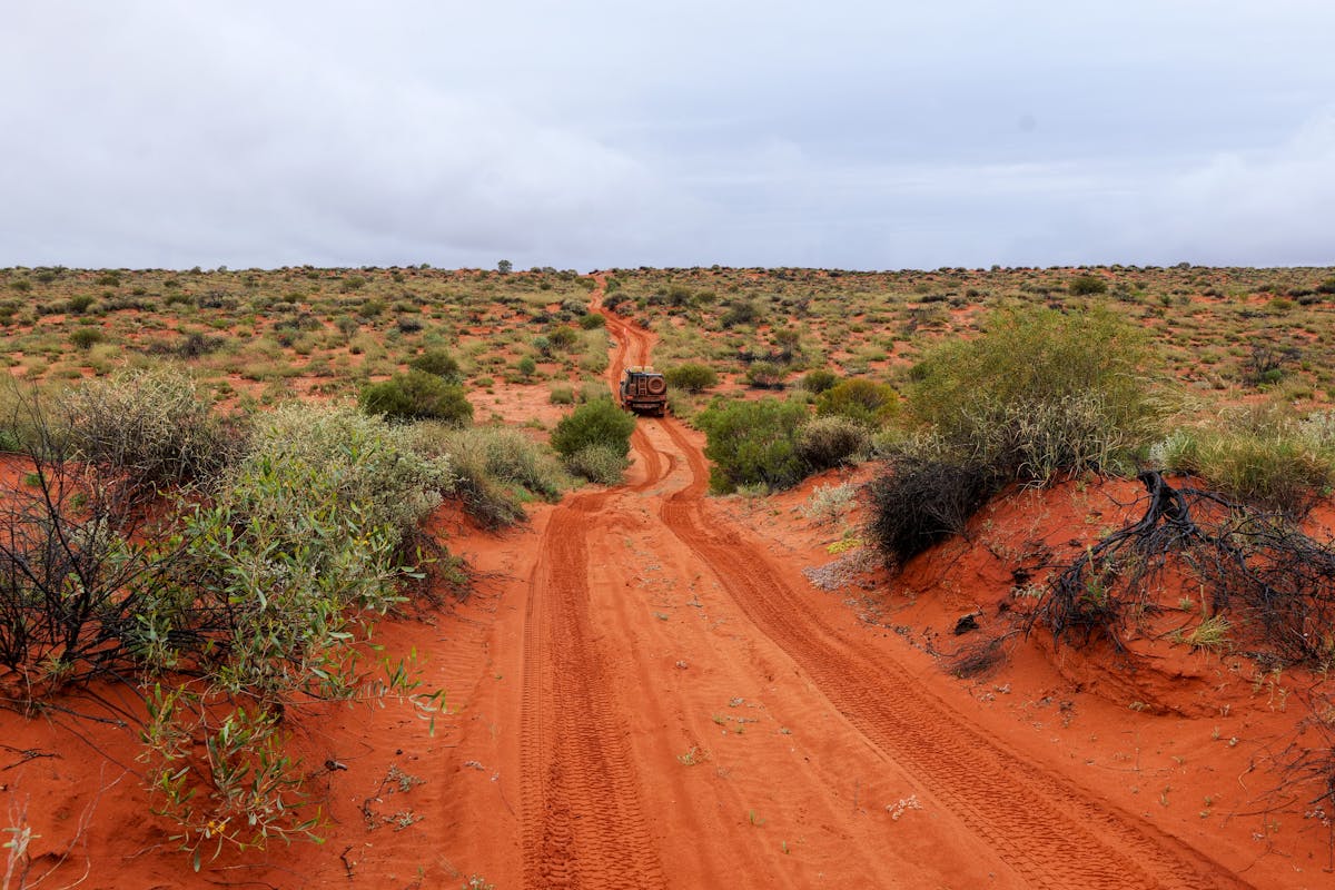 4WD with roof rack setup on an Australian outback road